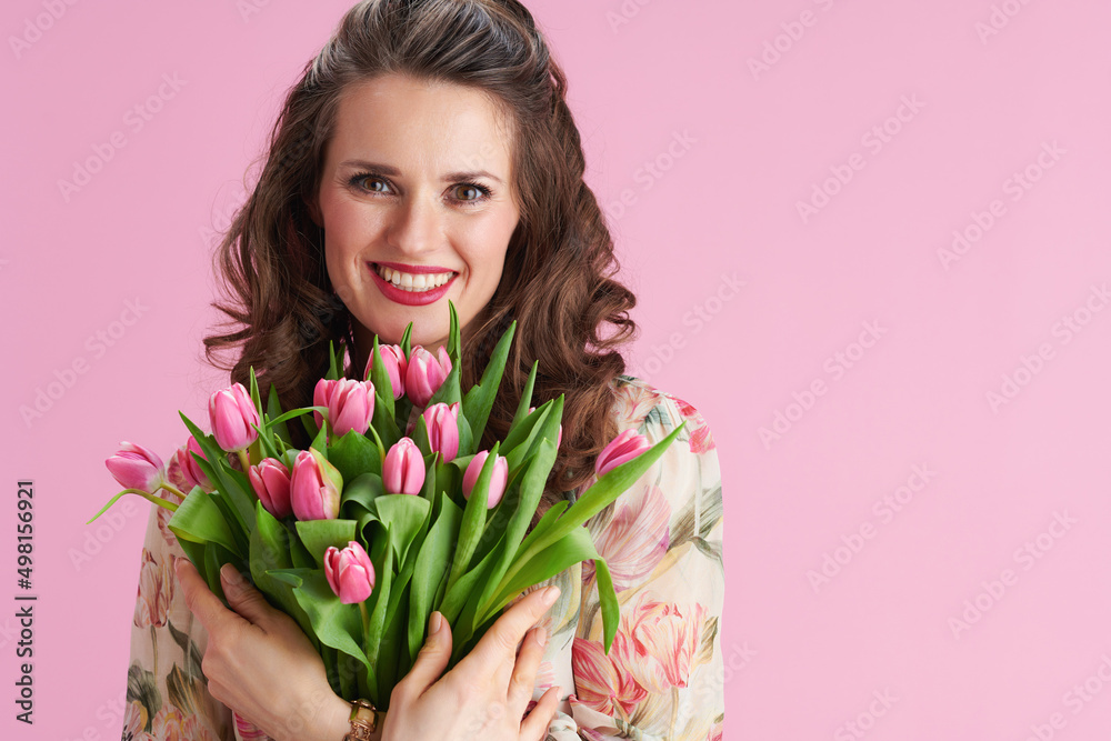 Portrait of happy woman with long wavy brunette hair on pink Portrait of happy woman with long wavy brunette hair on pink