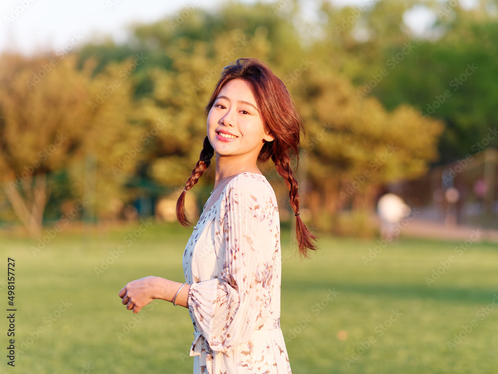 Portrait of elegant Chinese girl in dress enjoy carefree time in forest park in sunny day. Outdoor fashion portrait of glamour young Chinese cheerful stylish woman. Portrait of elegant Chinese girl in dress enjoy carefree time in forest park in sunny day. Outdoor fashion portrait of glamour young Chinese cheerful stylish woman.