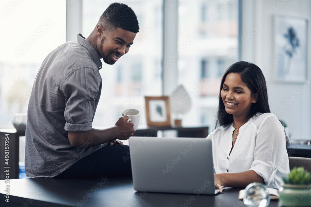 Coming together to source the solutions they need. Shot of two businesspeople working together on a laptop in an office. Coming together to source the solutions they need. Shot of two businesspeople working together on a laptop in an office.