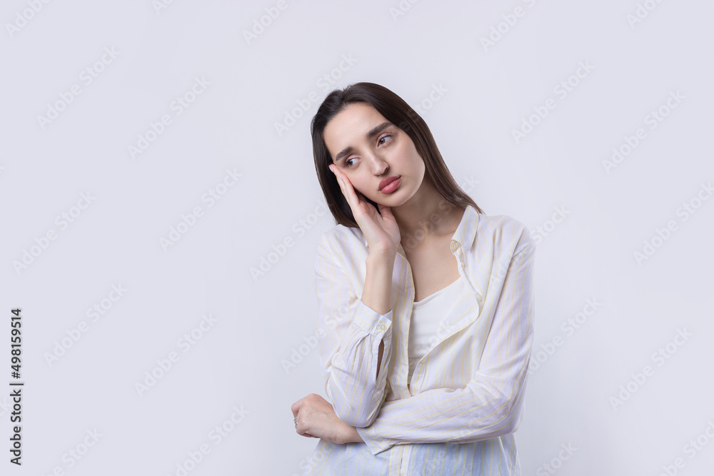 Portrait of a beautiful young woman thinking, isolated on white background Portrait of a beautiful young woman thinking, isolated on white background