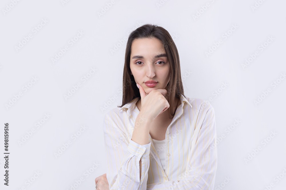 Portrait of a beautiful young woman thinking, isolated on white background Portrait of a beautiful young woman thinking, isolated on white background