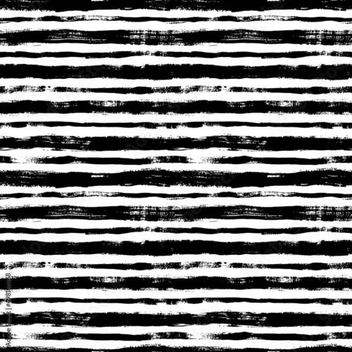 Bold horizontal line brush strokes seamless pattern. Hand drawn vector black lines with grunge texture. Modern fashion background. Grunge brushstrokes design. Ink illustration. Retro striped pattern 
