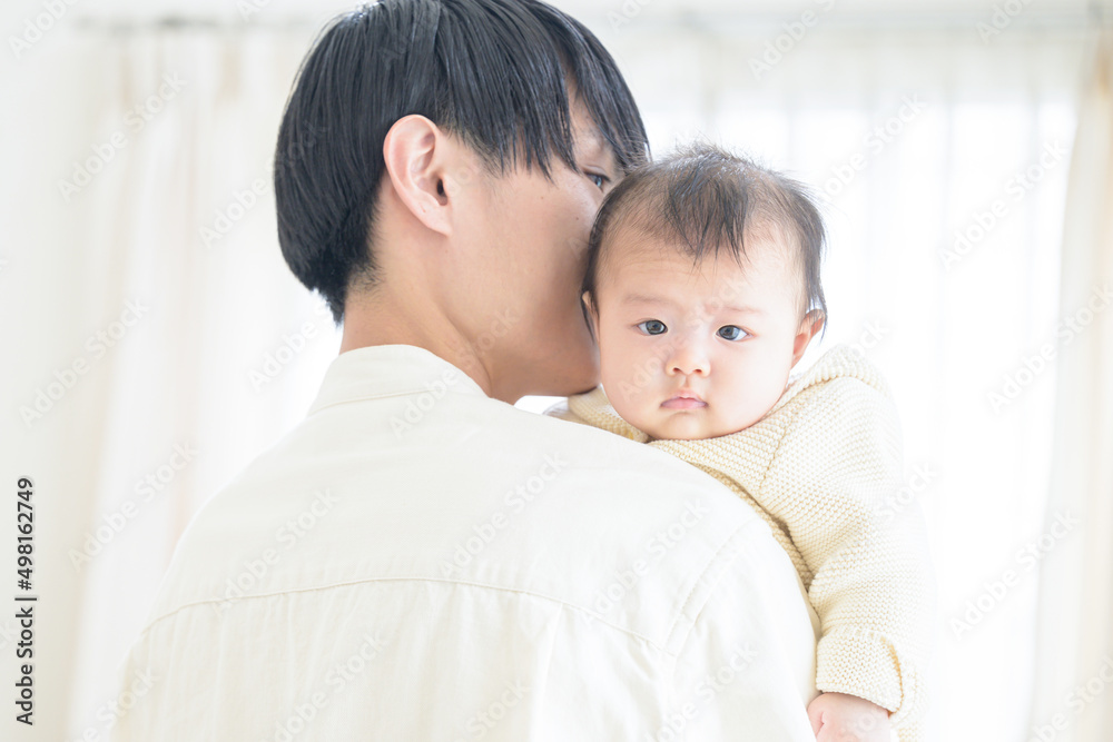 A father and a baby with a handsome man who could be used as an image of love. A father and a baby with a handsome man who could be used as an image of love.