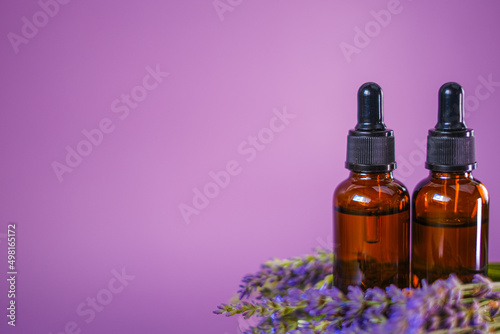 Lavender oil.Aroma of lavender.Essence with lavender scent. Aromatherapy and massage.Brown glass bottles of essential oil and lavender flowers.