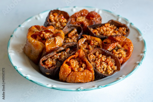 Dried eggplant stuffed and dried pepper stuffed with rice, tomato and olive oil known as dolma. (Turkish name; kuru biber dolmasi, kuru patlican dolmasi)
