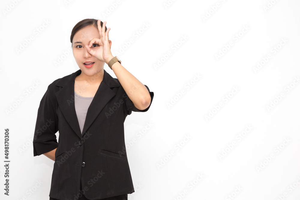 Beautiful Asian business woman wearing black suit okay sing presenting something on white background and copy space. Confident Asian working woman smiling and cheerful Beautiful Asian business woman wearing black suit okay sing presenting something on white background and copy space. Confident Asian working woman smiling and cheerful