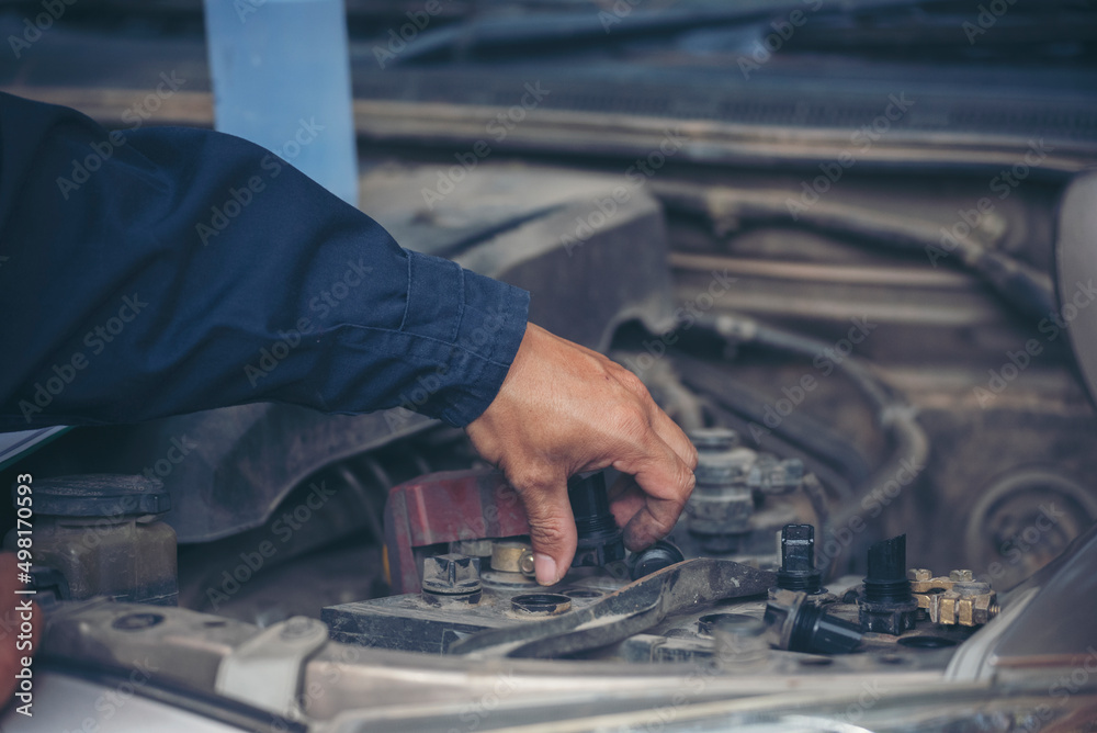 Mechanic car service auto garage in automotive mobile center. Technician workshop repair engine motor vehicles service mechanical engineering business. Automobile mechanic hands car repairs technic Mechanic car service auto garage in automotive mobile center. Technician workshop repair engine motor vehicles service mechanical engineering business. Automobile mechanic hands car repairs technic