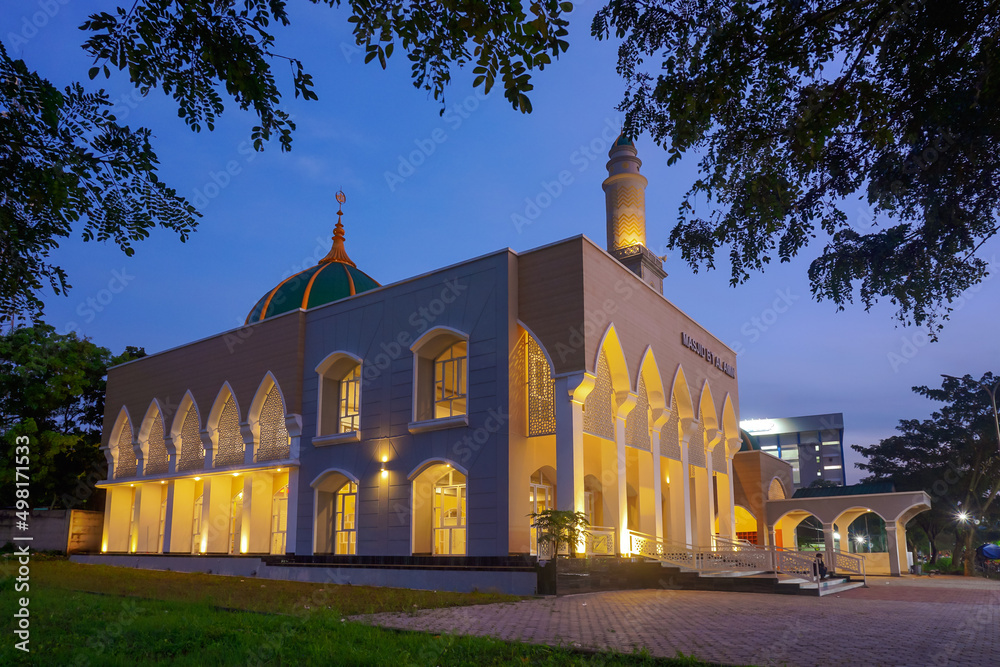 Beautiful mosque with orange light lamp. Perfect for background iedul fitri greeting cards or ramadan background