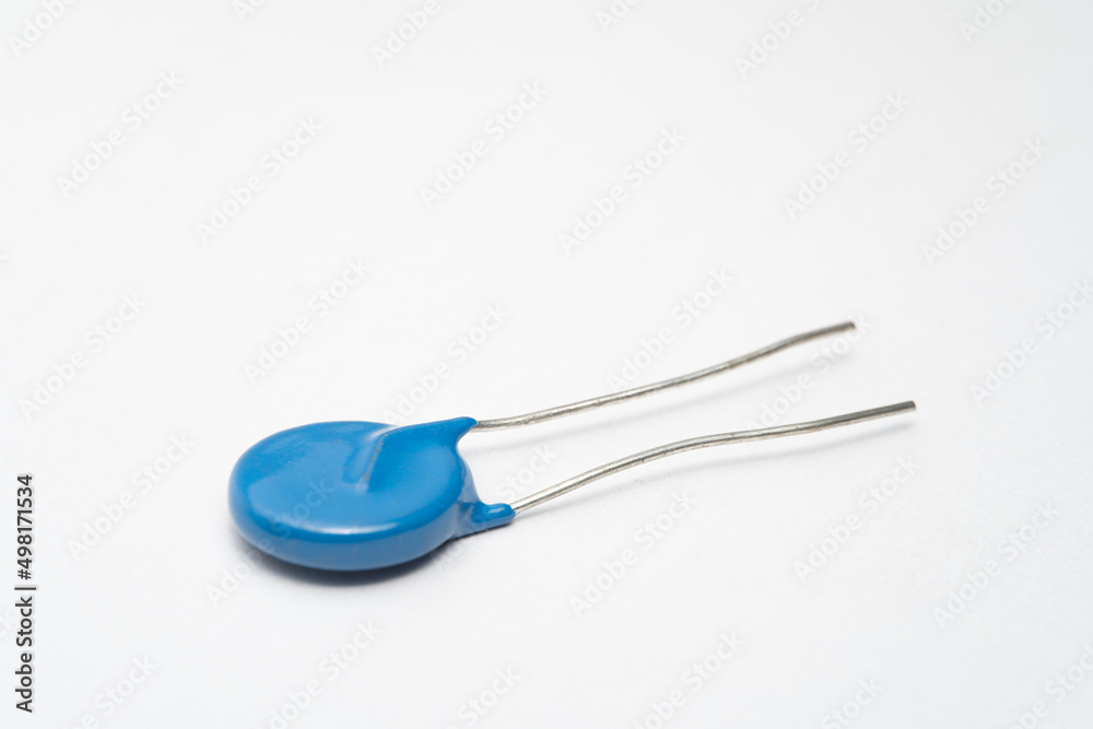 Isolated capacitor, used in electronic device. Electronic parts concept. Isolated capacitor, used in electronic device. Electronic parts concept.