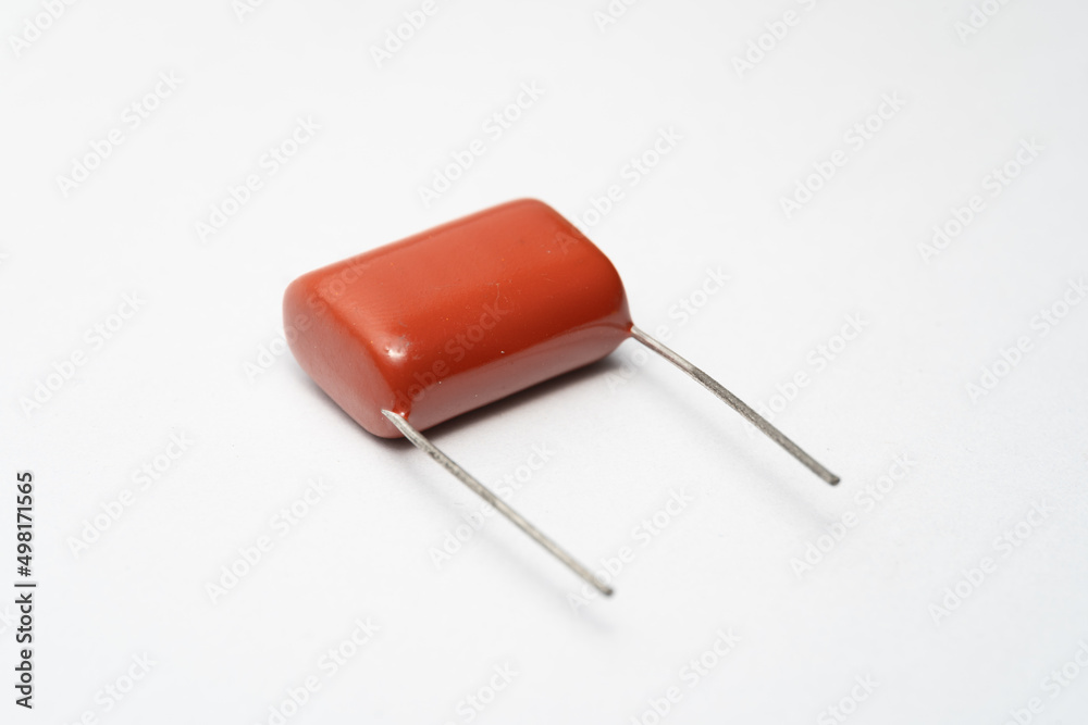 Isolated capacitor, used in electronic device. Electronic parts concept. Isolated capacitor, used in electronic device. Electronic parts concept.