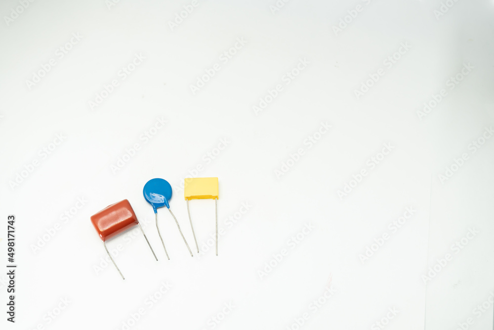 Group of capacitors different sizes isolated on white background. electrolytic capacitors