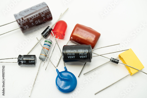 Group of various electronic components: diode, capacitors, resistors, LEDs. isolated on white background photo