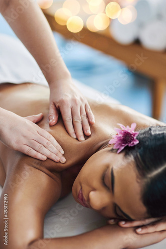 Permit yourself to pause. Shot of an attractive young woman getting a massage at a spa.