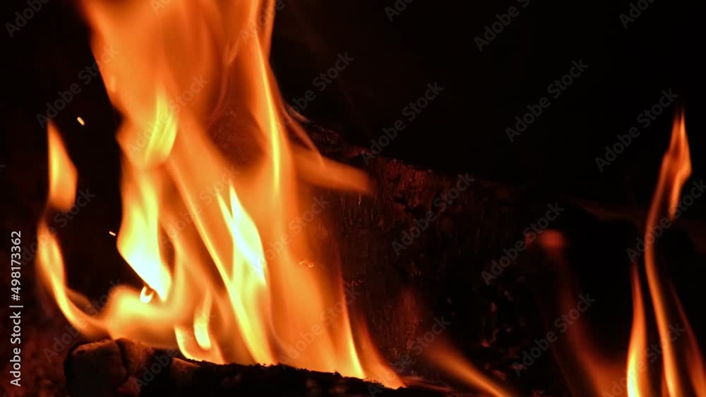 Wood Log Embers with Yellow Flames Burning in Fireplace Creating Cosy Romantic Mood Wood Log Embers with Yellow Flames Burning in Fireplace Creating Cosy Romantic Mood
