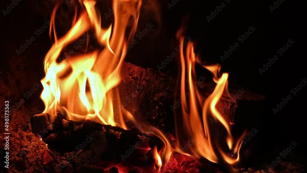 Wood Log Embers with Yellow Flames Burning in Fireplace Creating Cosy Romantic Mood Wood Log Embers with Yellow Flames Burning in Fireplace Creating Cosy Romantic Mood