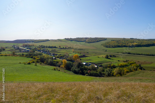 Village in the valley, view from the hill. Landscape of the countryside.