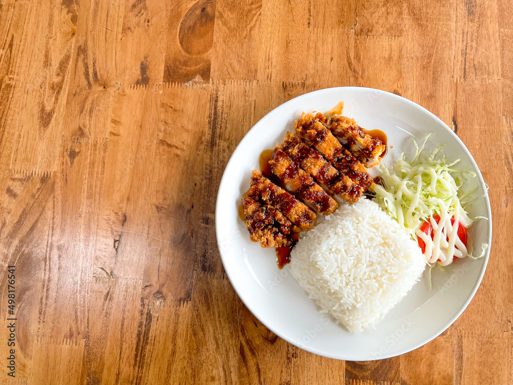 Homemade Tonkatsu rice (Thai style) with shredded cabbage salad. (Fried