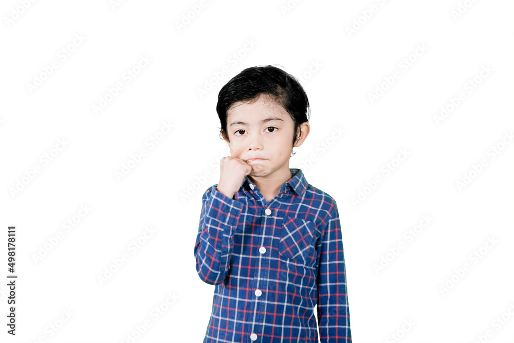 Cute little boy pinching his cheek on studio Cute little boy pinching his cheek on studio