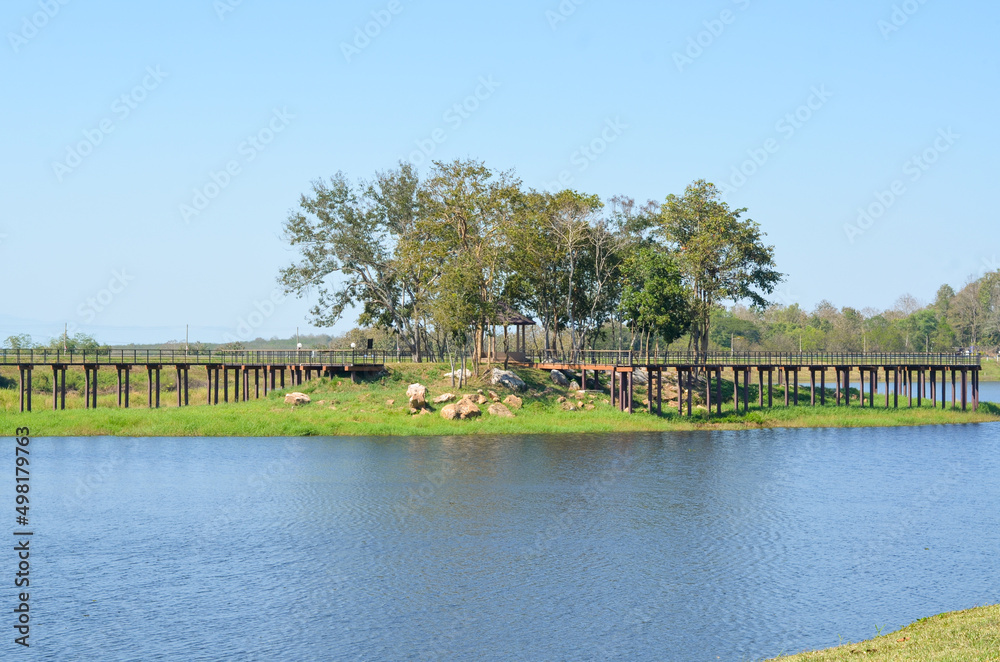 Fototapeta premium Wooden walkway over lake at Maepuem national park at Phayao province of Thailand