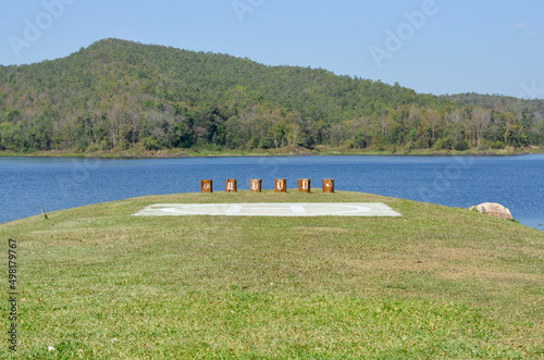 Translate Thai language is Maepuem. Maepuem is the name of national park at Phayao, Thailand and lake view with helipad photo