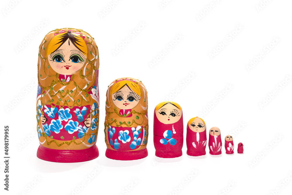 Red colored nesting dolls on a white background. Russian national souvenir