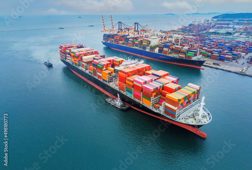 Canvas Print cargo ship and truck at seaport waiting for container dock crane shipment harbor loading container import and export commercial trade business logistic and transportation international