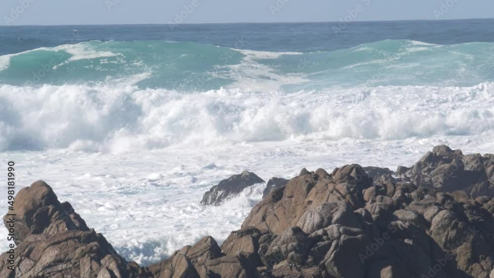 Big huge stormy waves crashing, rocky craggy beach, Monterey bay shore, California ocean coast USA. 17-mile drive power of nature. Sea water splashing. Pebble beach cliffs. Seamless looped cinemagraph Big huge stormy waves crashing, rocky craggy beach, Monterey bay shore, California ocean coast USA. 17-mile drive power of nature. Sea water splashing. Pebble beach cliffs. Seamless looped cinemagraph