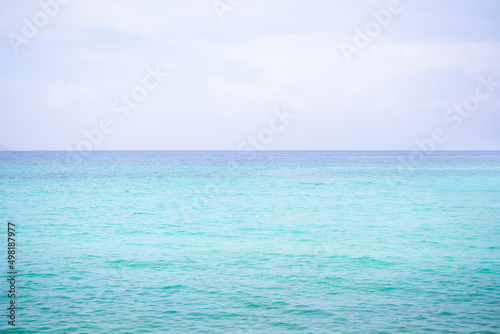 Blue Sea with White Cloud Sky Day Light Horizon view Background. Texture Surface Still Calm Peaceful of Water Ocean. Clean Clear Landscape. Tropical Travel Summer Holidays, Environment