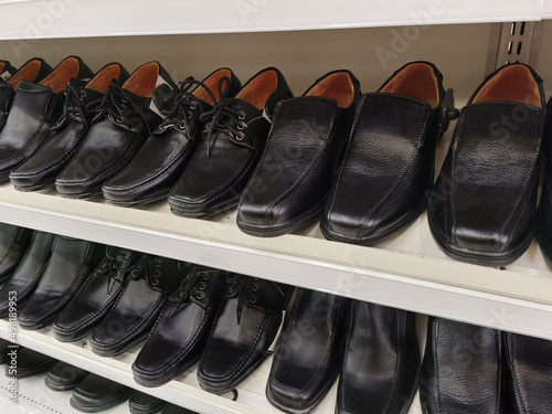 Men's fashion leather shoes on shop window. Concept of diversity, high quality, elegance, honest business relationship