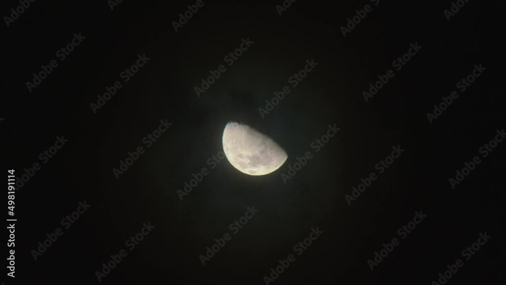 Cloudy night sky. Moon hiding as the clouds are appearing in the dark sky. Cloudy night sky. Moon hiding as the clouds are appearing in the dark sky.