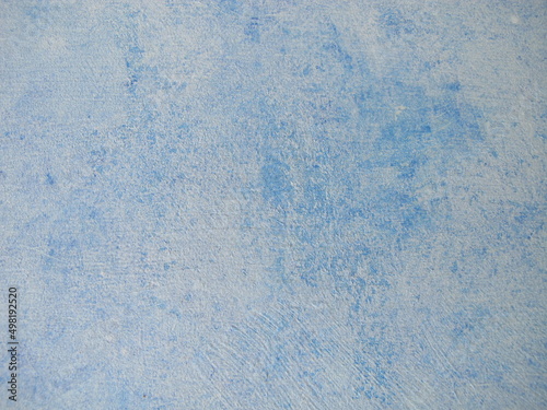 Wood painted with blue chalk paint and paint roller in vintage style