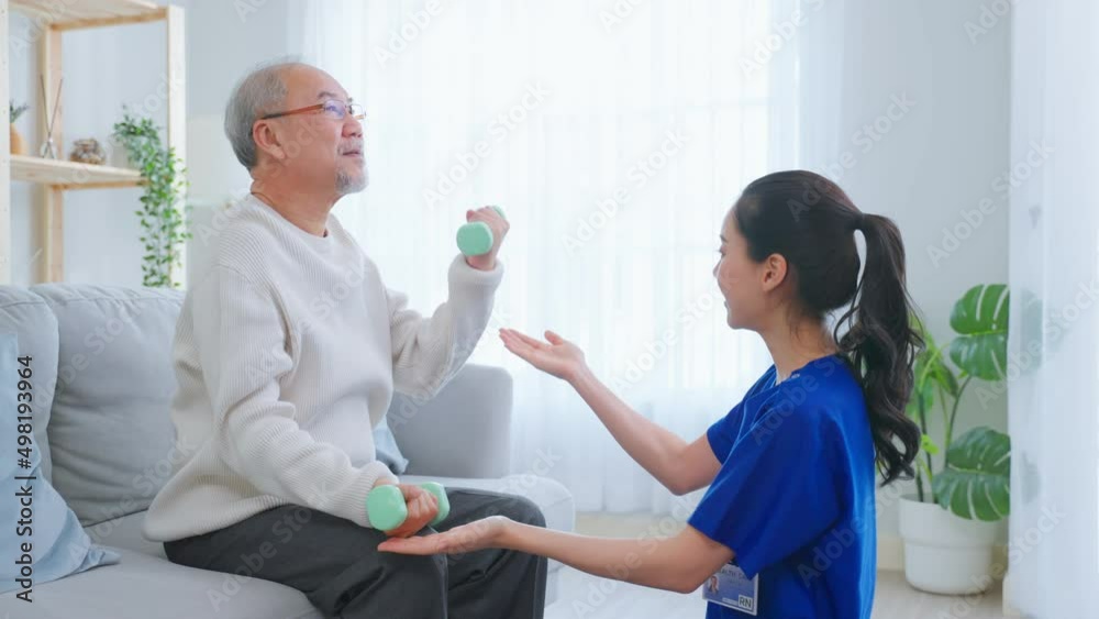 Asian senior older man doing physical therapy with support from nurse. Asian senior older man doing physical therapy with support from nurse.