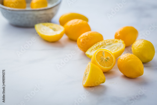 Small citrus fruits limequat with bowl on table photo