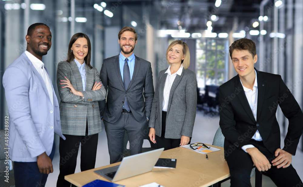 Group of successful business people on the background of the office. Group of successful business people on the background of the office.
