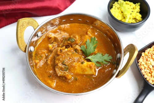 Dal Gosht or Daal Gosht is one of the very popular Mutton Recipes in India. Mutton cooked with spices and mixed lentils. Mutton dalcha with Tur dal and masoor dal. Copy space. Mutton curry in Kadai. photo