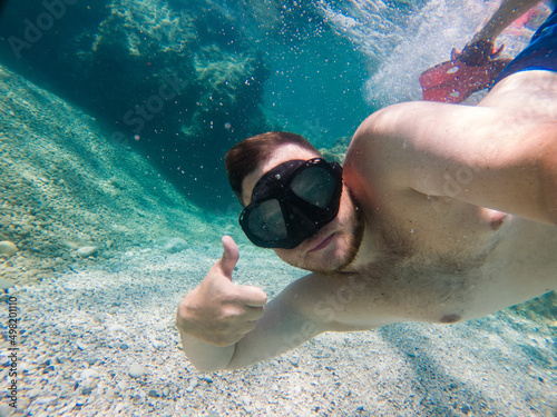 man in snorkeling mask selfie