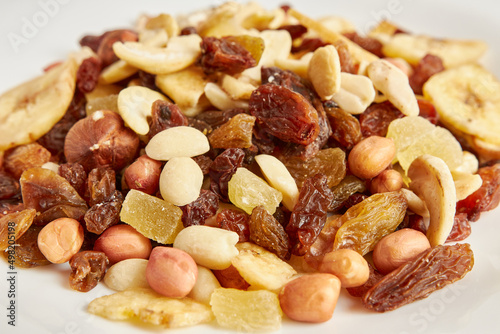 Assorted fruits and nuts. Dried healthy food. Dried grapes, peanuts, pineapple, banana, cashews, almonds.