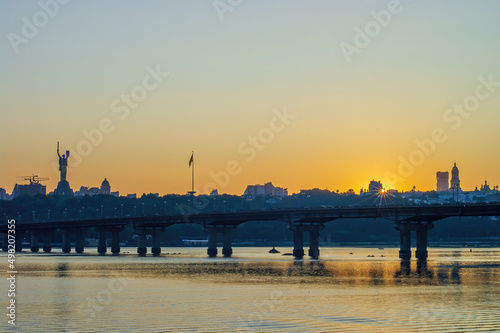 Scenic view of legendary metal Paton bridge across Dnieper river in Kyiv, Ukraine during sunset