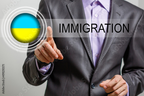 ukraine flag and virtual immigration button photo