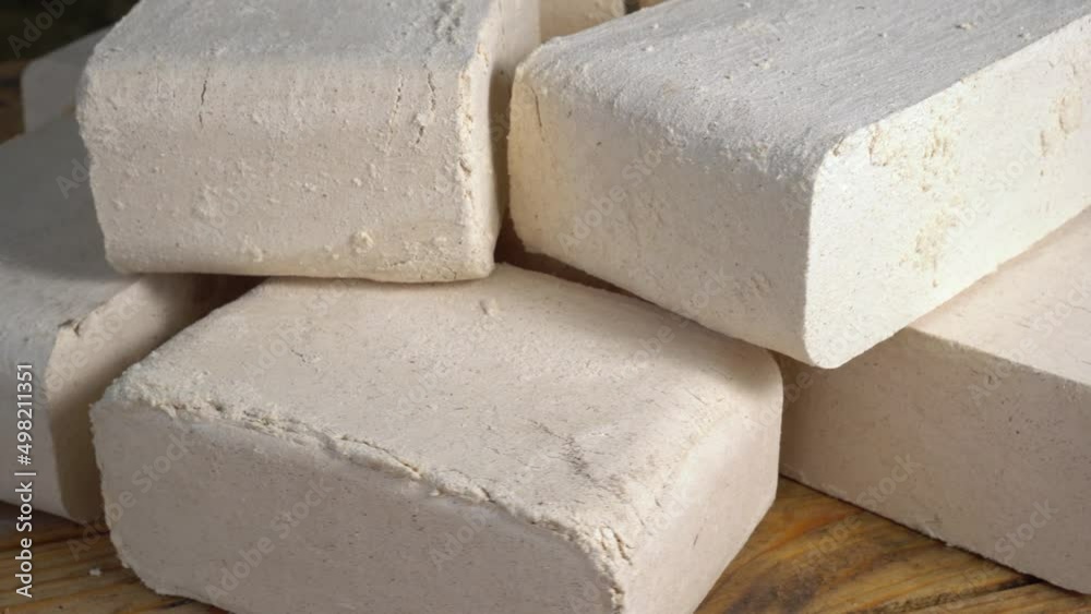 A briquette is a compressed block of combustible biomass material e.g. charcoal, sawdust, wood chips, peat, or paper used for fuel and kindling to start a fire.