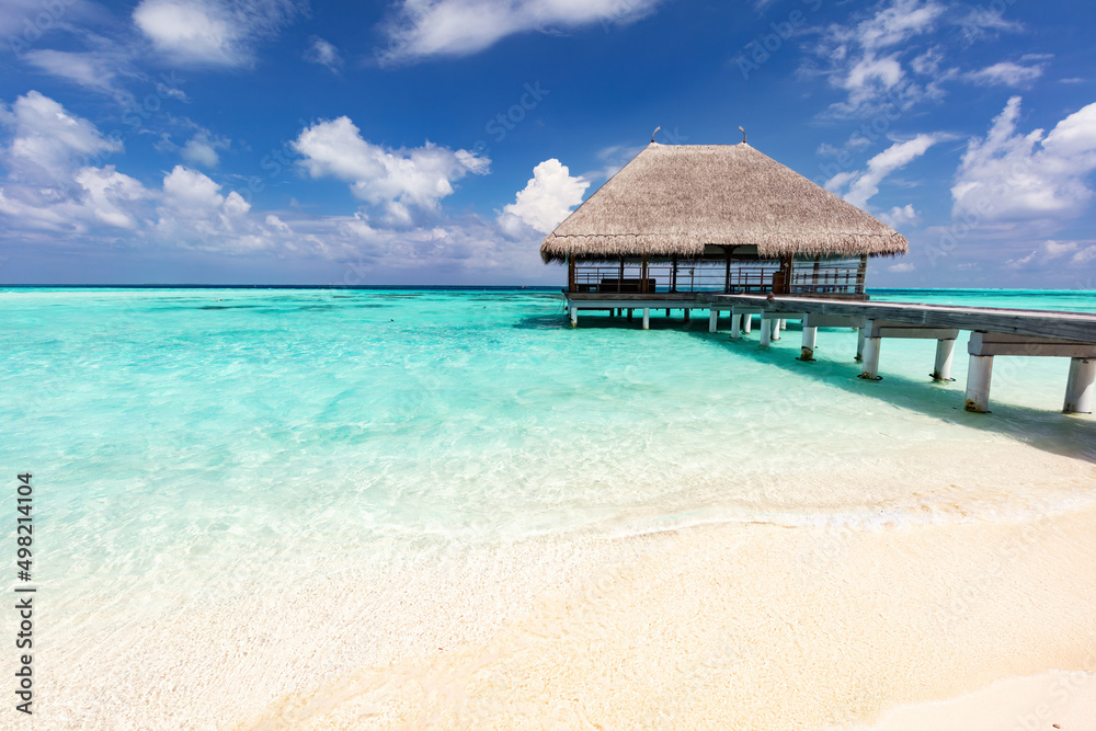 Beach in Maldives with wooden jetty