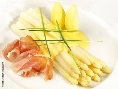 Asparagus wirh Parma Ham and Sauce Hollandaise isolated on white Background