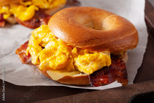 breakfast egg and bacon sandwich on bagel with cheese