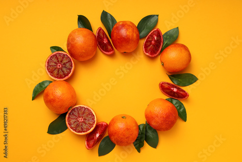 Concept of citrus with red orange on orange background