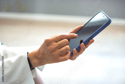 Businesswoman using smarphone indoors, copy space. Close up of a woman using her smartphone indoors. Cropped shot of a businesswoman using a mobile phone in a modern office