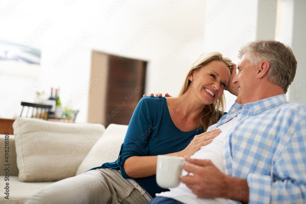 Every day is bliss when were together. Cropped shot of a mature couple relaxing together at home. Every day is bliss when were together. Cropped shot of a mature couple relaxing together at home.