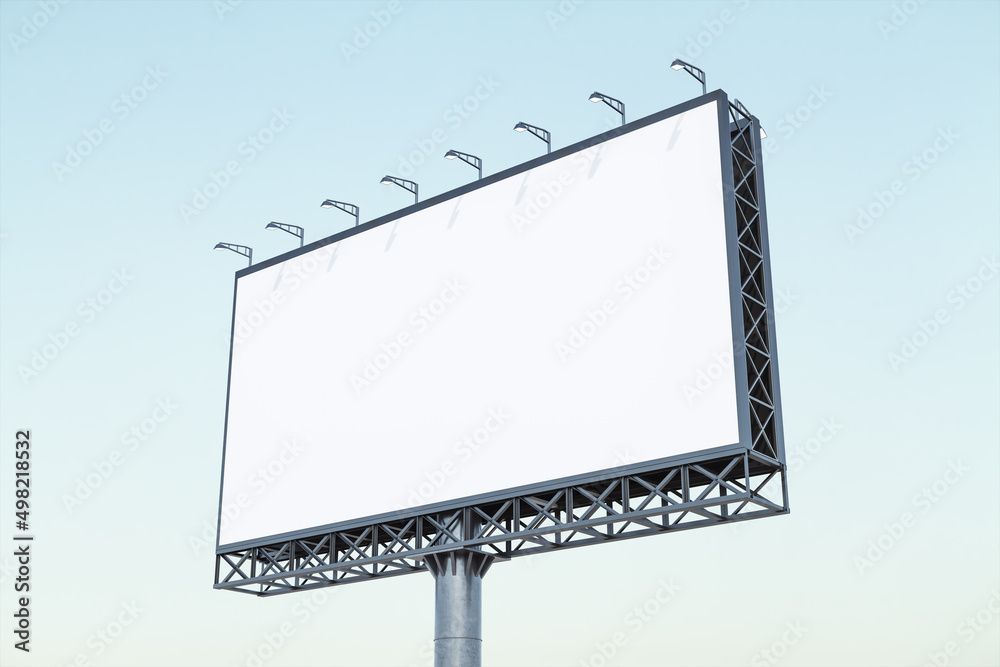 Blank white billboard on blue sky background at sunset, perspective view. Mock up, advertising concept Blank white billboard on blue sky background at sunset, perspective view. Mock up, advertising concept