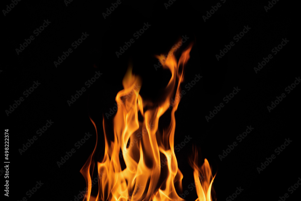 Close up burning flames on black background for graphic design or wallpaper Close up burning flames on black background for graphic design or wallpaper