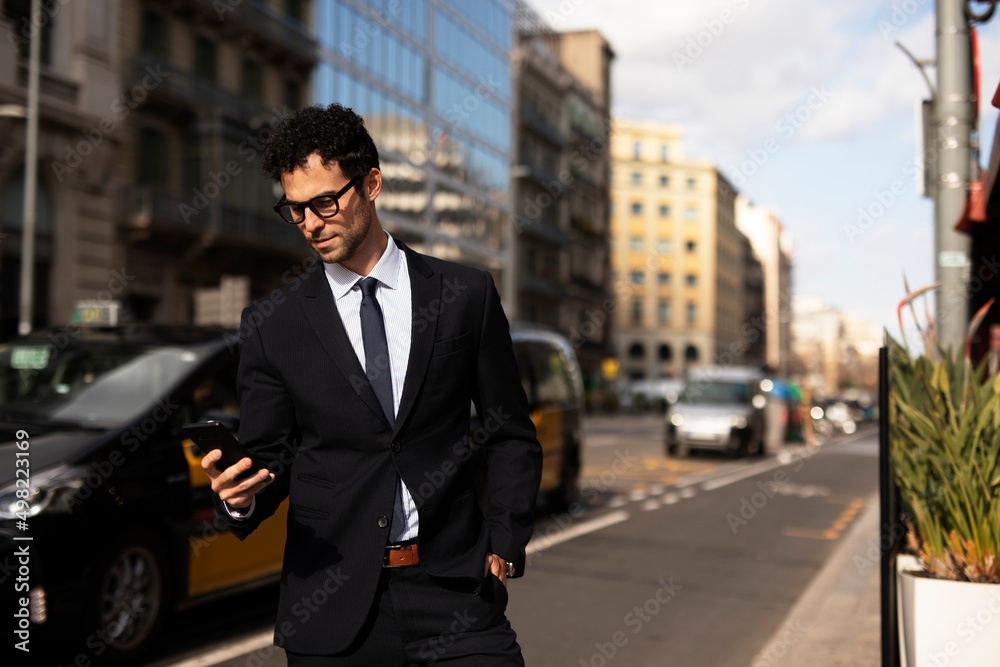 custom made wallpaper toronto digitalHandsome businessman using the phone. Young elegance man outdoors..