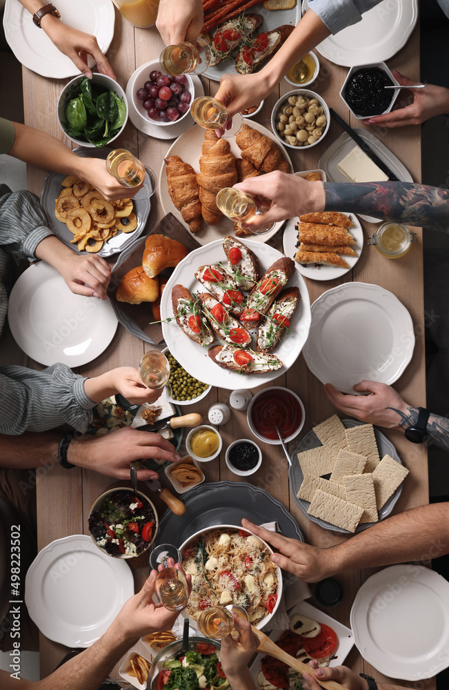 Group of people having brunch together at table, top view Group of people having brunch together at table, top view
